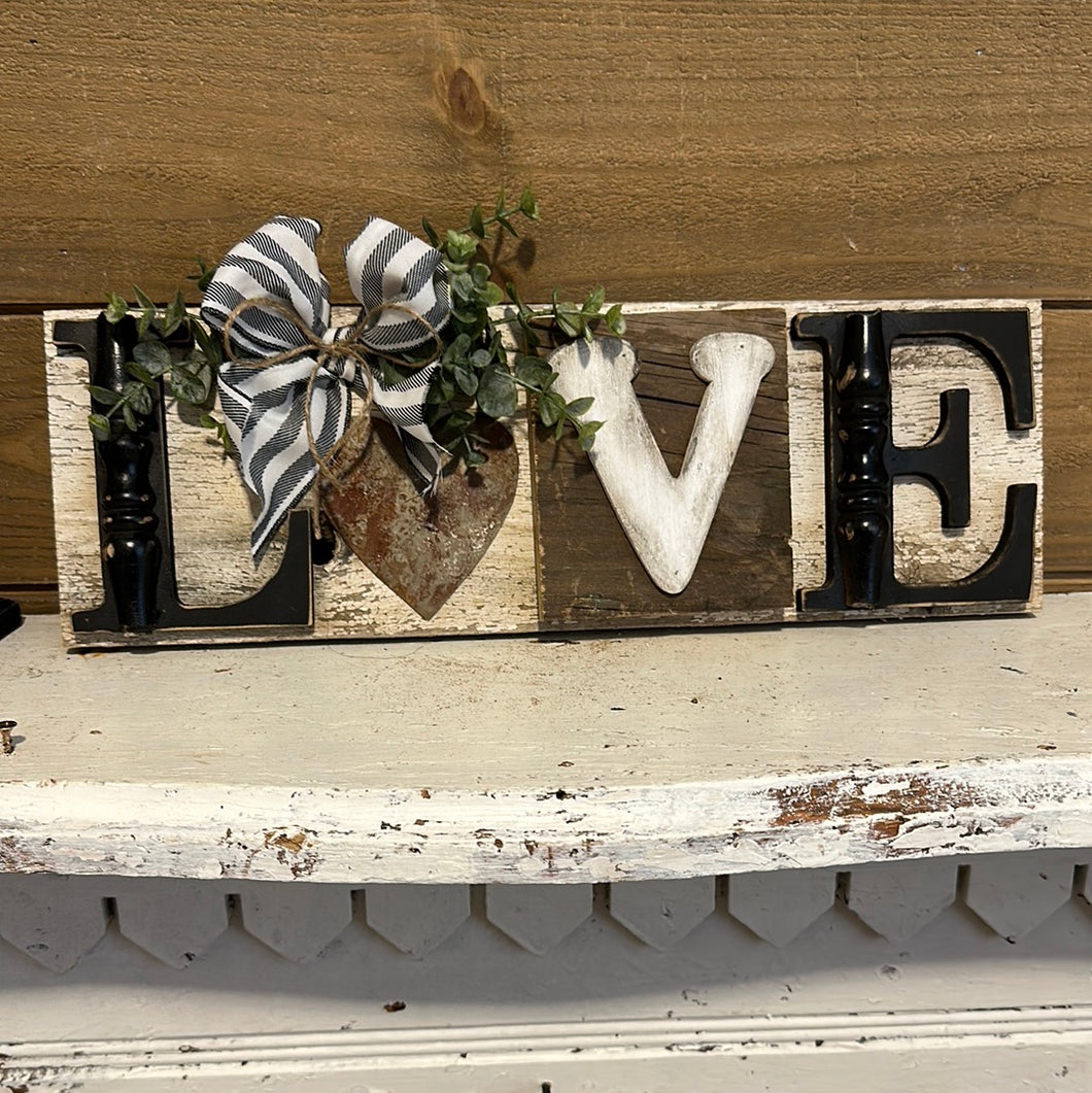 LOVE Sign on chippy white