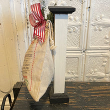 Load image into Gallery viewer, Santa bag hanging on small post

