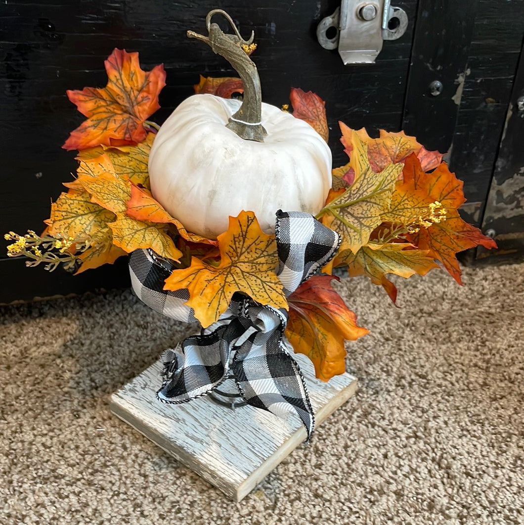 Fall leaves and pumpkin on spring