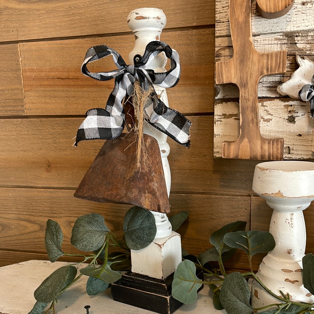 Cow bell on spindle