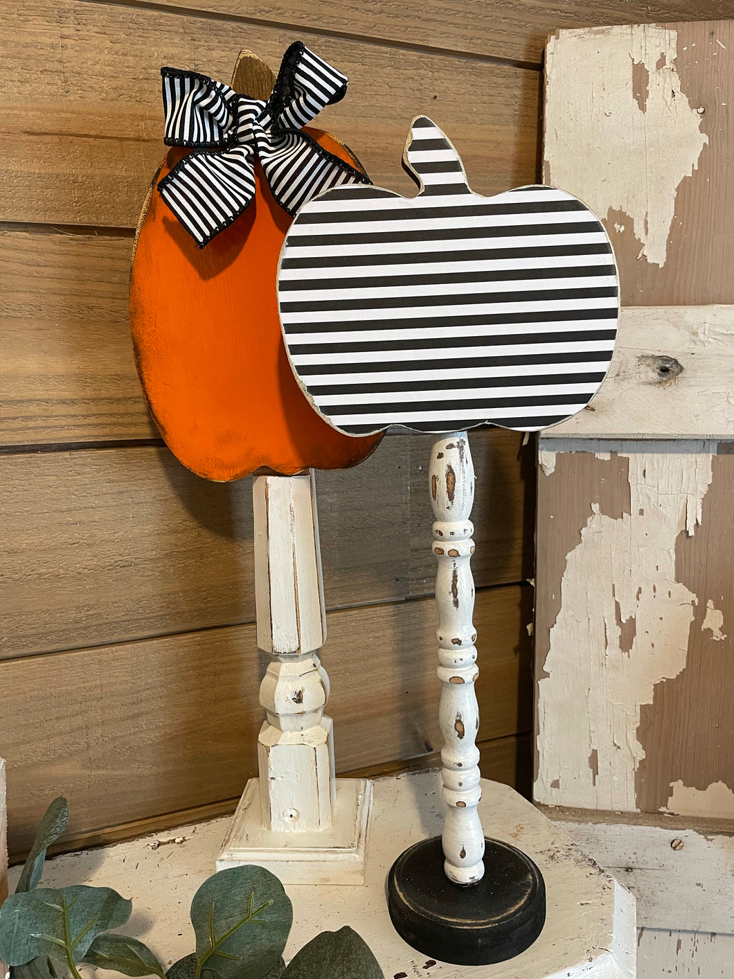 Stripe pumpkins on spindles