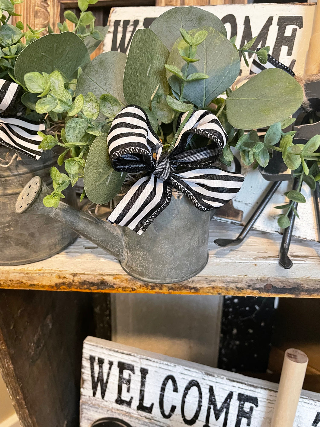 Small watering can arrangement