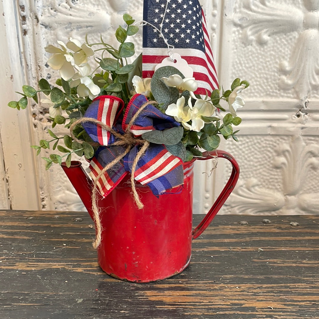 Red pouring pitcher arrangement
