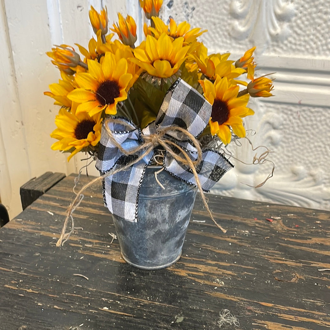 Mini sunflowers in bucket
